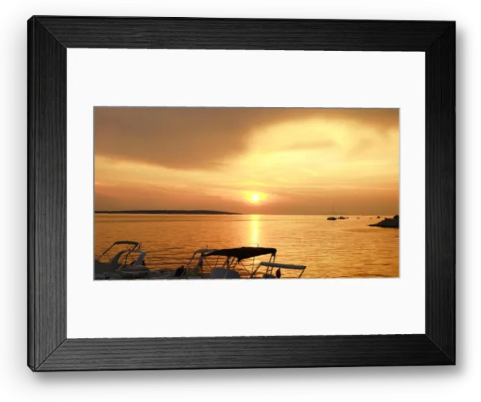 Framed Print : Sunset on the sea with dramatic sky in beige color tone and silhouette of boats Framed Print : Sunset on the sea with dramatic sky in beige color tone and silhouette of boats