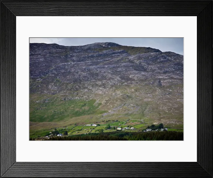 Framed Print : Homes nestling at the foot of the Maumturk mountain range near Recess in Connemara, County Galway, Ireland