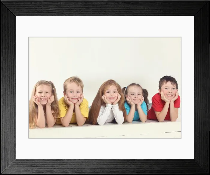 Framed Print : Five happy children (three girls and two boys) pose in white studio Framed Print : Five happy children (three girls and two boys) pose in white studio
