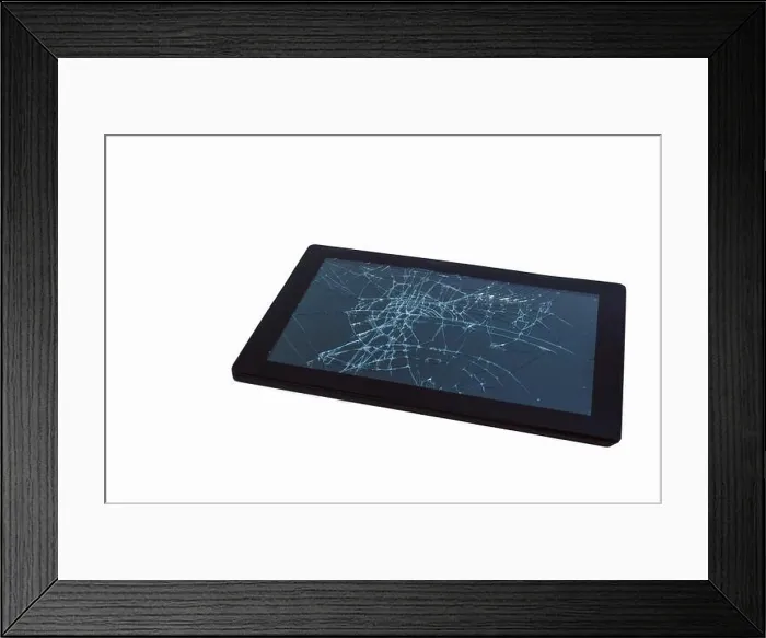 Framed Print : A broken tablet computer as detailed close-up shot on neutral white background Framed Print : A broken tablet computer as detailed close-up shot on neutral white background