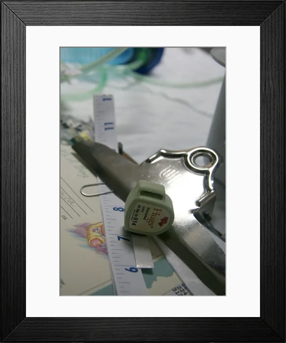 Framed Print : Hugs brand medical alert tag for babies at hospital to prevent abductions Framed Print : Hugs brand medical alert tag for babies at hospital to prevent abductions