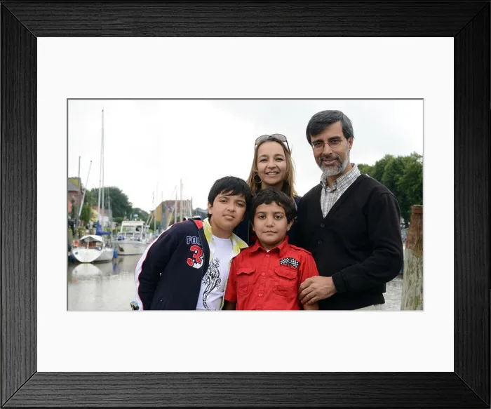 Framed Print : Afghan boy Entizar (red shirt) poses with his guest family Mudjib (L-R) Framed Print : Afghan boy Entizar (red shirt) poses with his guest family Mudjib (L-R)