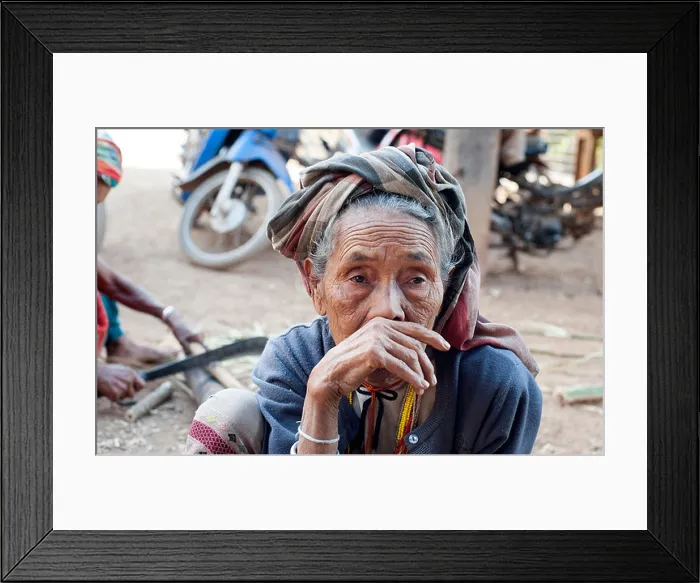 Framed Print : Karen villager in contemplative mood sits outside. Huay Pakoot village, northern Thailand Framed Print : Karen villager in contemplative mood sits outside. Huay Pakoot village, northern Thailand