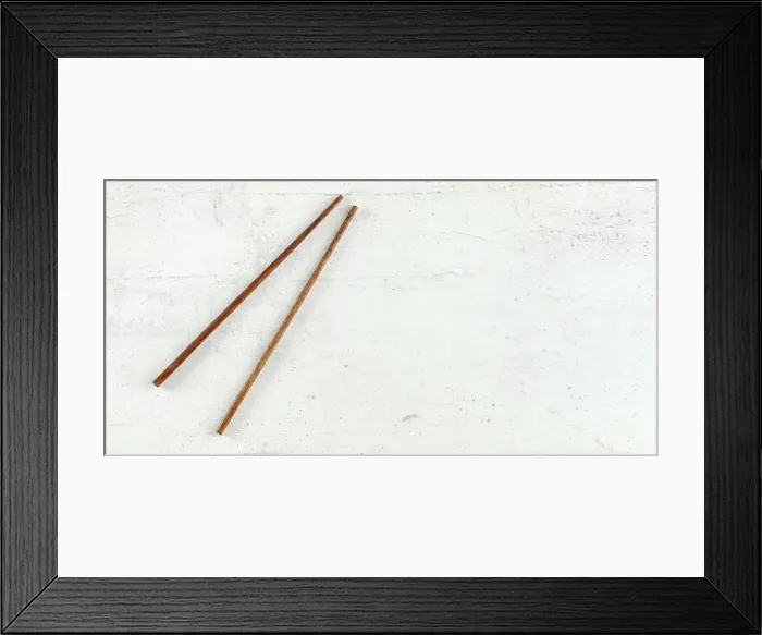 Framed Print : Top down view - pair of dark wood chopsticks on white board Framed Print : Top down view - pair of dark wood chopsticks on white board