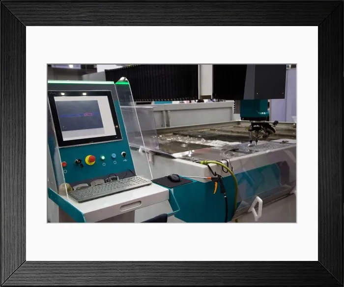 Framed Print : Modern CNC Abrasive water jet cutting machine using high pressure water jet to cut metal Framed Print : Modern CNC Abrasive water jet cutting machine using high pressure water jet to cut metal