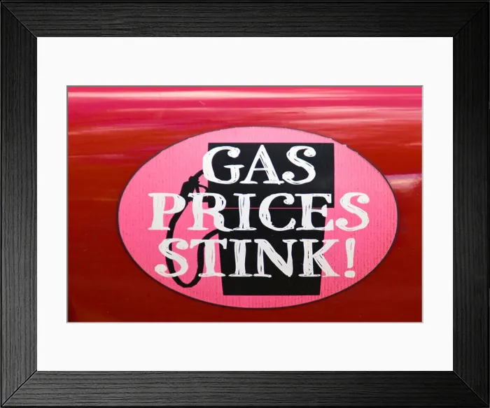 Framed Print : A sticker that has 'GAS PRICES STINK' affixed on an automobile Framed Print : A sticker that has 'GAS PRICES STINK' affixed on an automobile