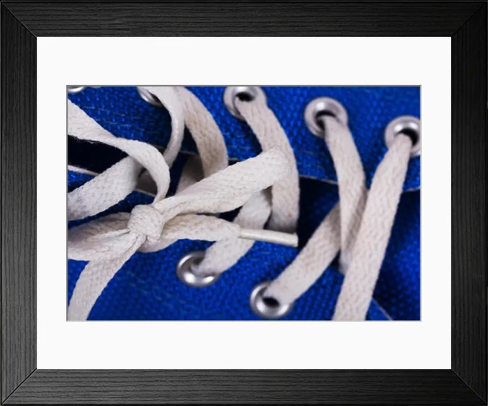 Framed Print : Old worn canvas shoes on a wooden floor Framed Print : Old worn canvas shoes on a wooden floor