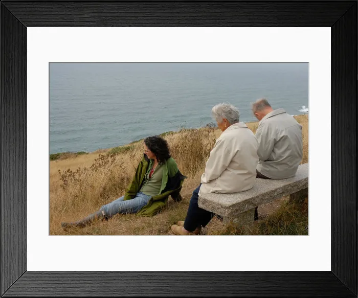 Framed Print : Elderly couple with their daughter sitting and looking out towards the sea Framed Print : Elderly couple with their daughter sitting and looking out towards the sea