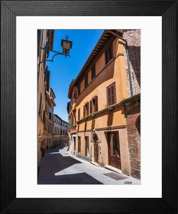 Framed Print : Narrow, winding street of Via di Voltaia nel Corso in Montepulciano, Tuscany, Italy Framed Print : Narrow, winding street of Via di Voltaia nel Corso in Montepulciano, Tuscany, Italy