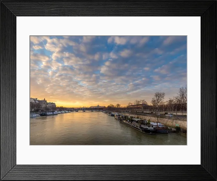 Framed Print : Paris, France - February 12, 2021: Seine river and Grand Palais in background with a beautiful cloudy sunset in Paris Framed Print : Paris, France - February 12, 2021: Seine river and Grand Palais in background with a beautiful cloudy sunset in Paris