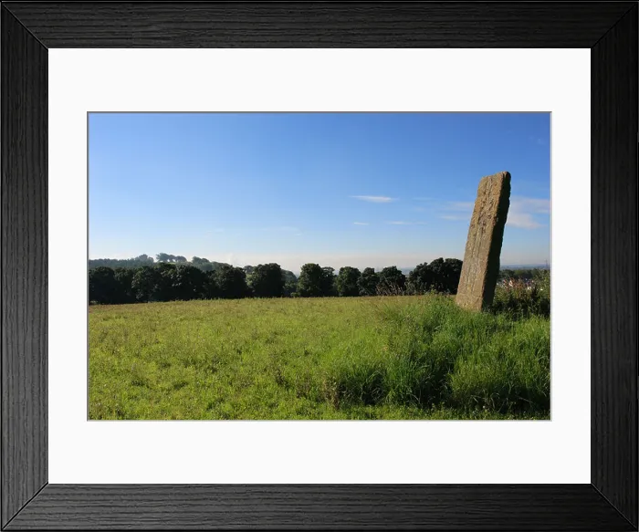 Framed Print : Parkmill Cross Slab carved standing stone near Alloa, Clackmannanshire with Clackmannan Tower on the horizon Framed Print : Parkmill Cross Slab carved standing stone near Alloa, Clackmannanshire with Clackmannan Tower on the horizon