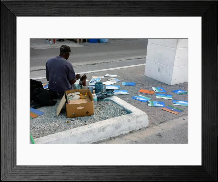 Framed Print : Street artist selling his paintings on the street near Straw market in Nassau, Bahamas, Caribbean Framed Print : Street artist selling his paintings on the street near Straw market in Nassau, Bahamas, Caribbean
