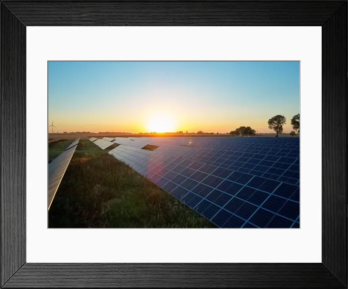 Framed Print : Rows of solar panels in field at sunset. Renewable energy concept Framed Print : Rows of solar panels in field at sunset. Renewable energy concept