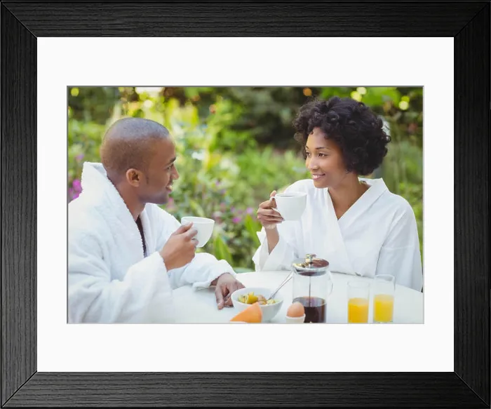 Framed Print : Happy couple taking breakfast in the garden Framed Print : Happy couple taking breakfast in the garden