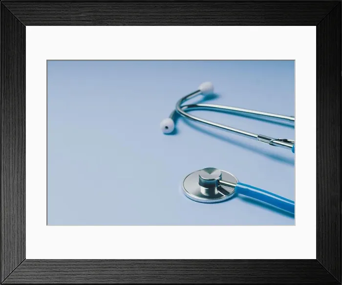 Framed Print : Close-up of Blue stethoscope of doctor for checkup on blue background Framed Print : Close-up of Blue stethoscope of doctor for checkup on blue background