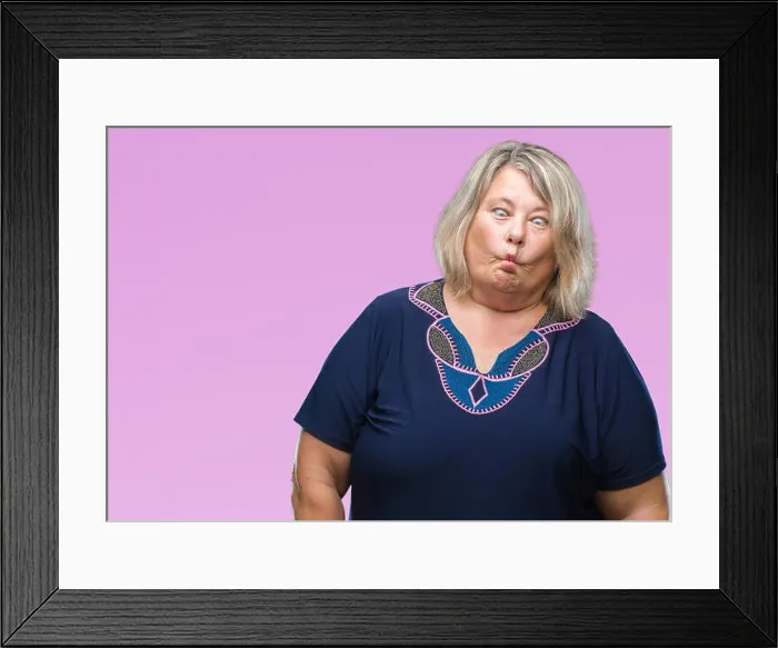 Framed Print : Senior plus size caucasian woman over isolated background making fish face with lips