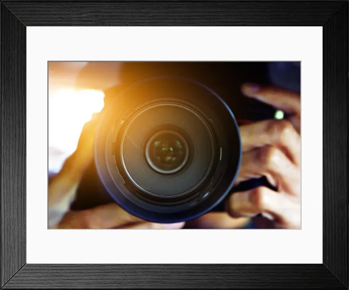 Framed Print : Man using DSLR camera taking photo Framed Print : Man using DSLR camera taking photo