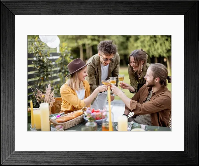 Framed Print : Young friends dining at backyard of the country house in nature Framed Print : Young friends dining at backyard of the country house in nature