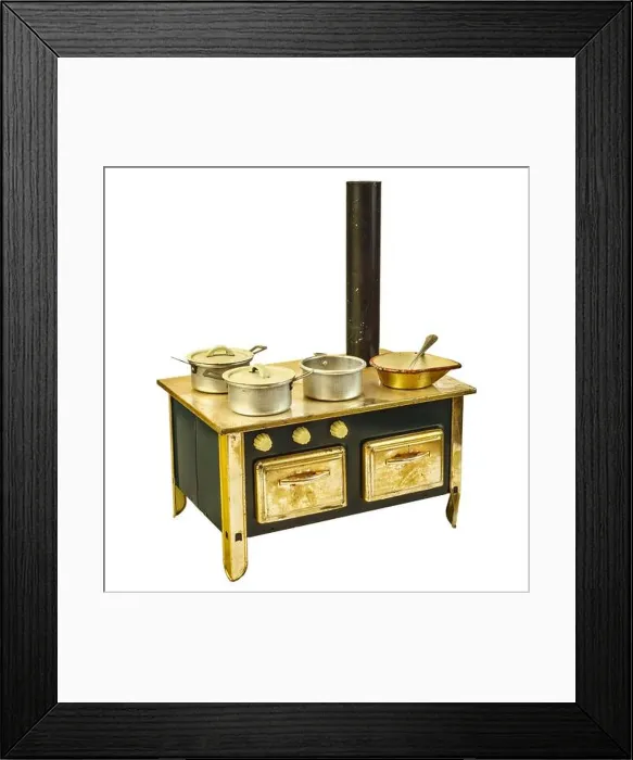 Framed Print : Vintage doll house cooking stove with pans isolated on a white background Framed Print : Vintage doll house cooking stove with pans isolated on a white background