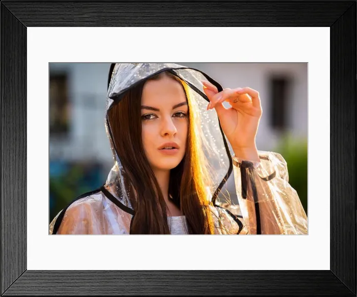 Framed Print : Young beautiful woman in hooded raincoat on rainy day Framed Print : Young beautiful woman in hooded raincoat on rainy day