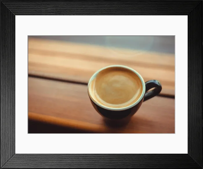 Framed Print : americano coffee on a side of the window in the morning, selective focus. vintage photo and film style Framed Print : americano coffee on a side of the window in the morning, selective focus. vintage photo and film style