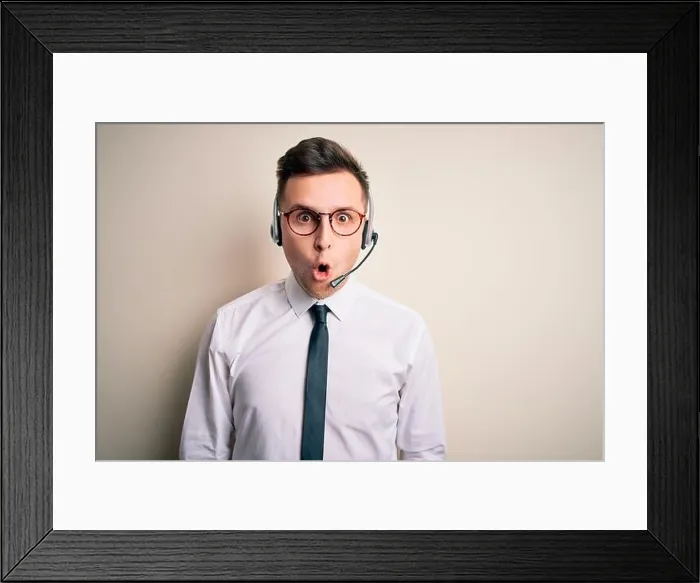 Framed Print : Young handsome caucasian business man wearing call center headset at customer service afraid Framed Print : Young handsome caucasian business man wearing call center headset at customer service afraid