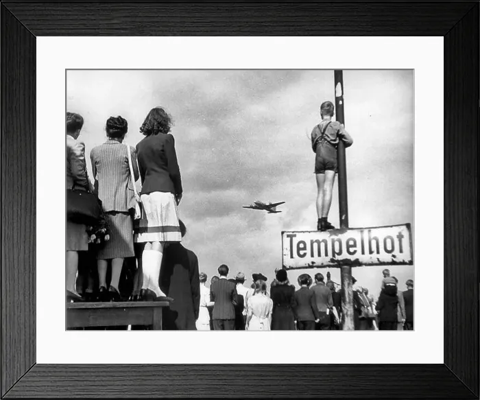Framed Print : Civilians watching an airlift plane land during the Berlin Blockade, 1948 Framed Print : Civilians watching an airlift plane land during the Berlin Blockade, 1948