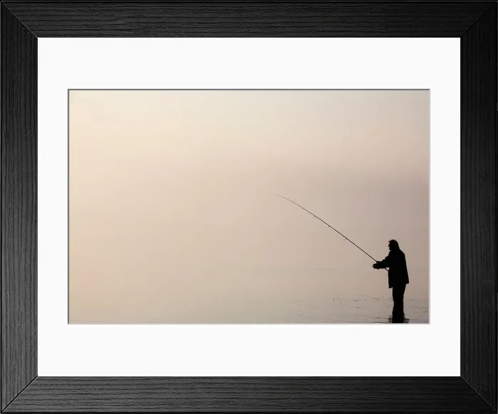 Framed Print : The silhouette of a lone angler fishing in Bassenthwaite Lake in the Lake District Framed Print : The silhouette of a lone angler fishing in Bassenthwaite Lake in the Lake District