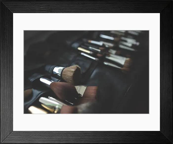 Framed Print : This image features a collection of makeup brushes