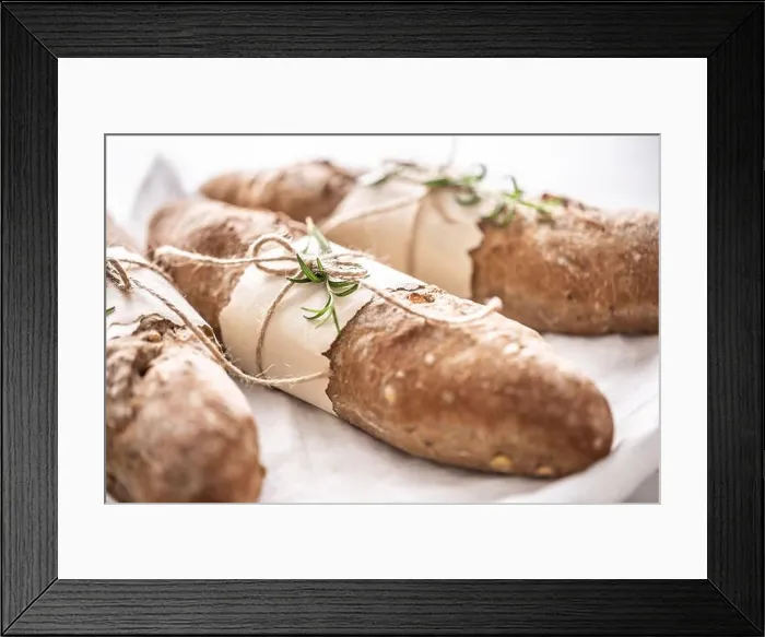 Framed Print : Detail of fresh crusty wholegrain breads on a white surface Framed Print : Detail of fresh crusty wholegrain breads on a white surface
