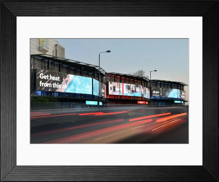 Framed Print : Digital advertising hoardings promoting the domestic energy company E-on on the Talgarth Road Framed Print : Digital advertising hoardings promoting the domestic energy company E-on on the Talgarth Road