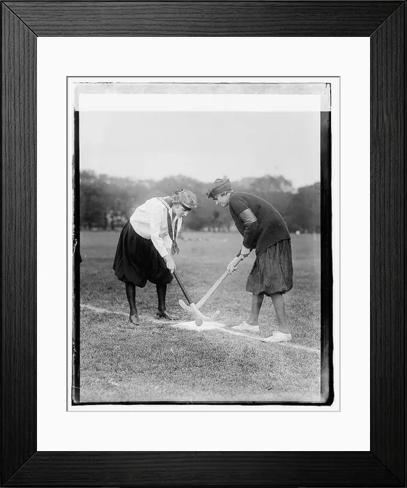 Framed Print : A group of girls is shown playing hockey