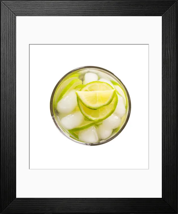 Framed Print : refreshing lemonade with green lemon and ice isolated on white background close-up top view Framed Print : refreshing lemonade with green lemon and ice isolated on white background close-up top view
