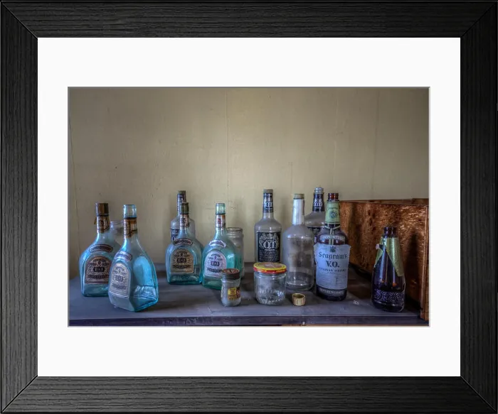 Framed Print : BIRMINGHAM, ALABAMA, USA: Empty bottles of spirits stand abandoned and forgotten Framed Print : BIRMINGHAM, ALABAMA, USA: Empty bottles of spirits stand abandoned and forgotten