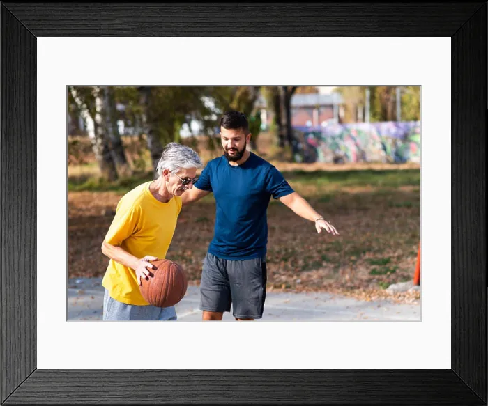 Framed Print : Father and son playing basketball in the park Framed Print : Father and son playing basketball in the park