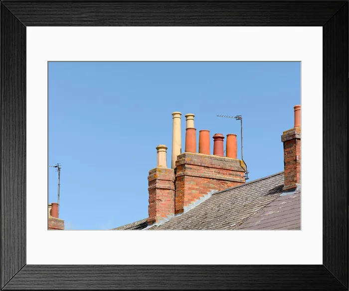 Framed Print : Victorian chimneys and TV aerial on roof of building Framed Print : Victorian chimneys and TV aerial on roof of building