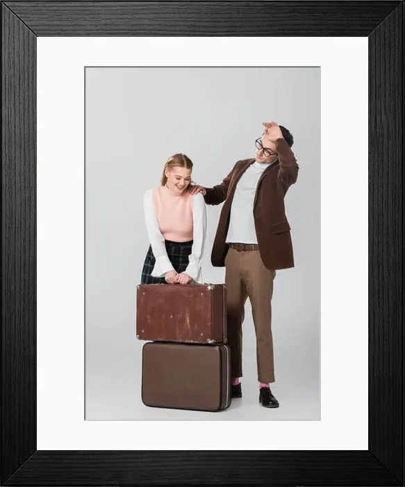 Framed Print : young woman laughing near suitcases and tired boyfriend on grey background Framed Print : young woman laughing near suitcases and tired boyfriend on grey background
