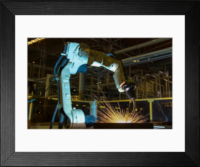 Framed Print : Robot is welding part in automotive factory Framed Print : Robot is welding part in automotive factory