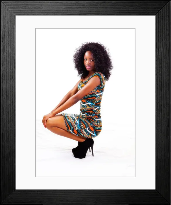Framed Print : Attractive Black Teen Girl In Dress Squatting Framed Print : Attractive Black Teen Girl In Dress Squatting