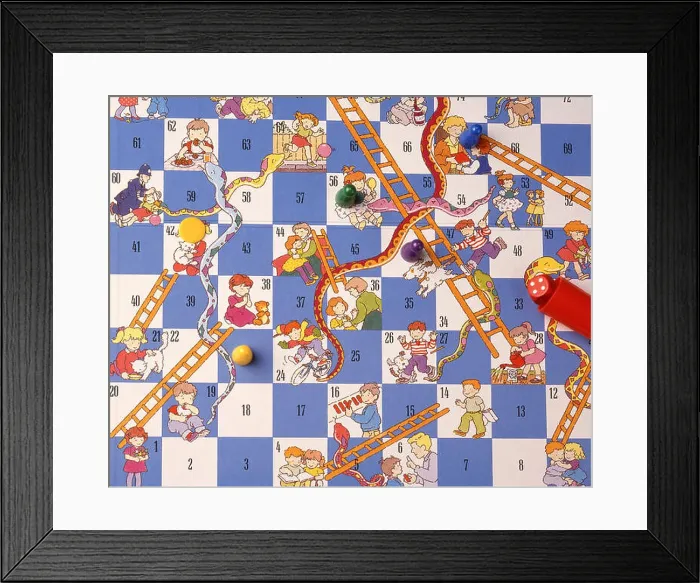 Framed Print : Snakes & Ladders board game with dice and counters (still-life) Framed Print : Snakes & Ladders board game with dice and counters (still-life)