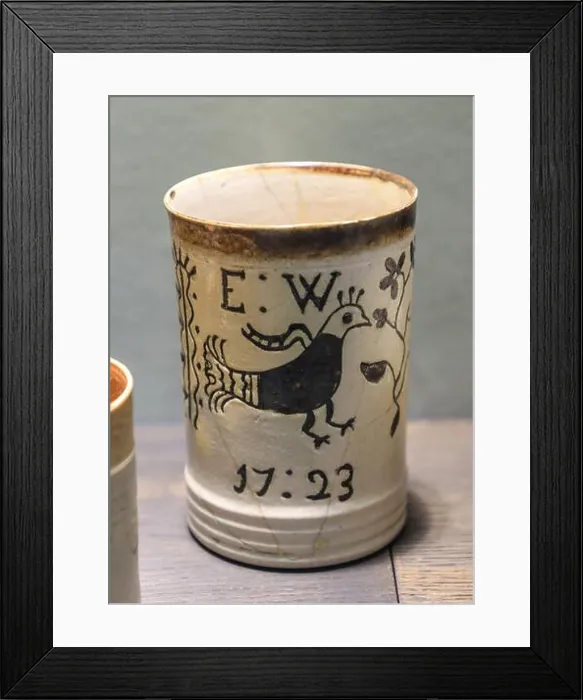 Framed Print : A white dipped earthenware tankard from 1723 on display at the Potteries Museum and Art Gallery Framed Print : A white dipped earthenware tankard from 1723 on display at the Potteries Museum and Art Gallery