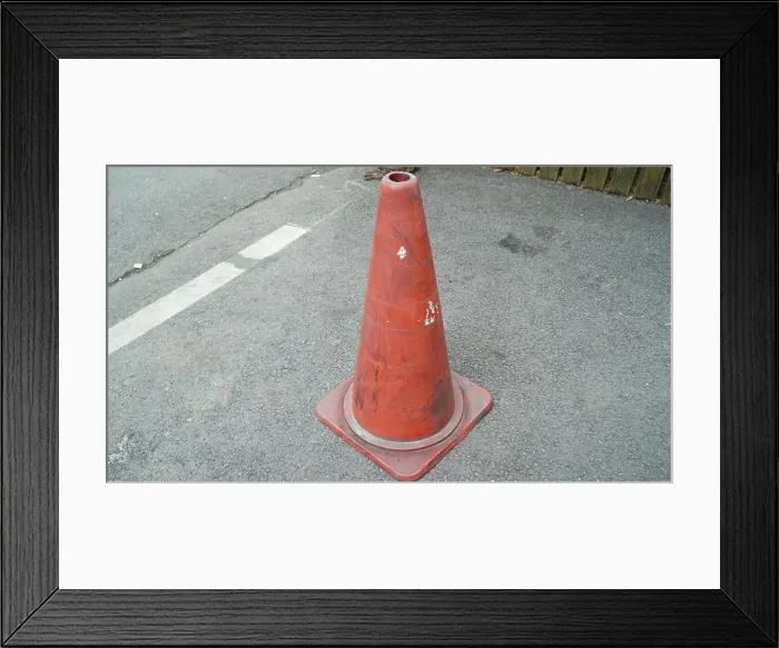 Framed Print : Traffic Cone with White Horizontal Stripe Paint Erased on the Asphalt Side Walk Framed Print : Traffic Cone with White Horizontal Stripe Paint Erased on the Asphalt Side Walk