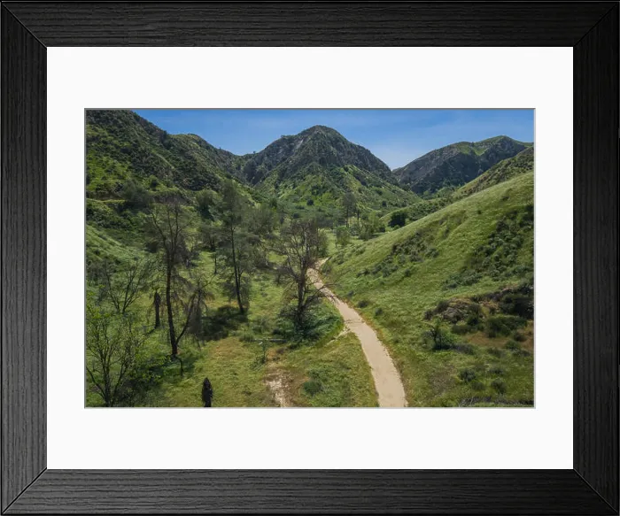 Framed Print : Dirt walking trail winds up through the green hills of Southern California Framed Print : Dirt walking trail winds up through the green hills of Southern California