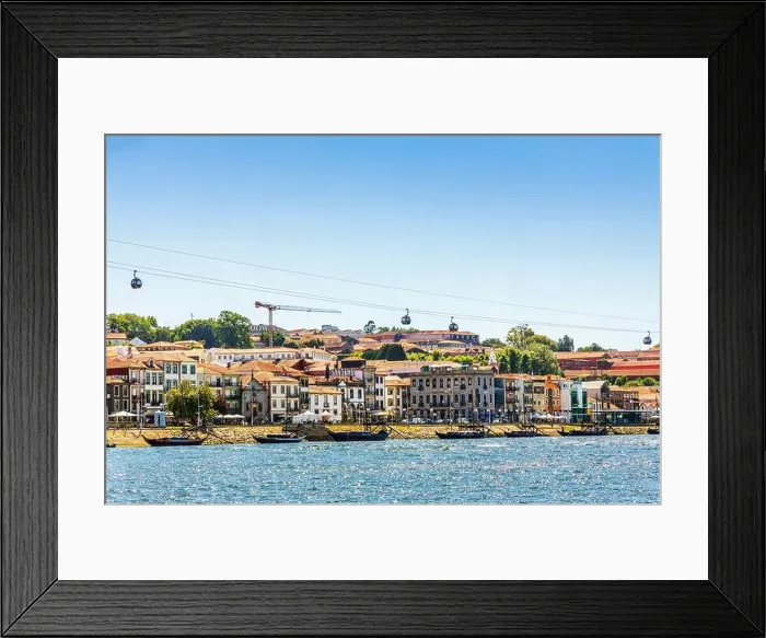 Framed Print : Vila Nova de Gaia, Portugal - May 7, 2021: Cityscape of architecture with many porto wine cellars Framed Print : Vila Nova de Gaia, Portugal - May 7, 2021: Cityscape of architecture with many porto wine cellars