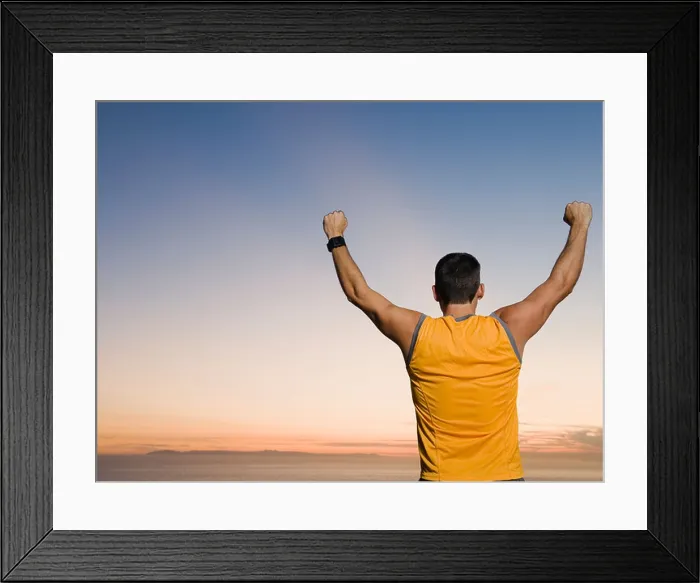 Framed Print : Man raising arms Framed Print : Man raising arms