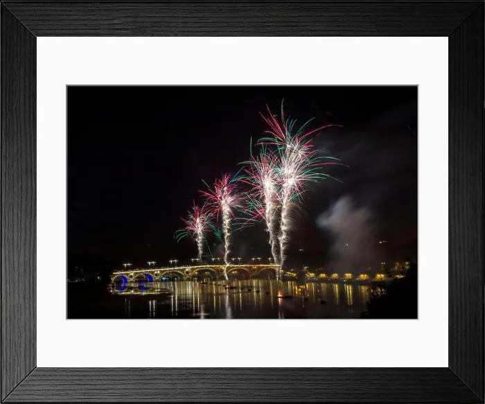 Framed Print : France - Toulouse - Pont Neuf - pale bouquets rise above glowing arches, smoke drifting over the river Framed Print : France - Toulouse - Pont Neuf - pale bouquets rise above glowing arches, smoke drifting over the river