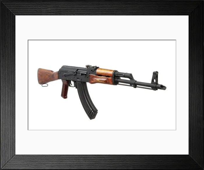 Framed Print : Classic Soviet-style assault rifle with wooden stock and black magazine on white background Framed Print : Classic Soviet-style assault rifle with wooden stock and black magazine on white background