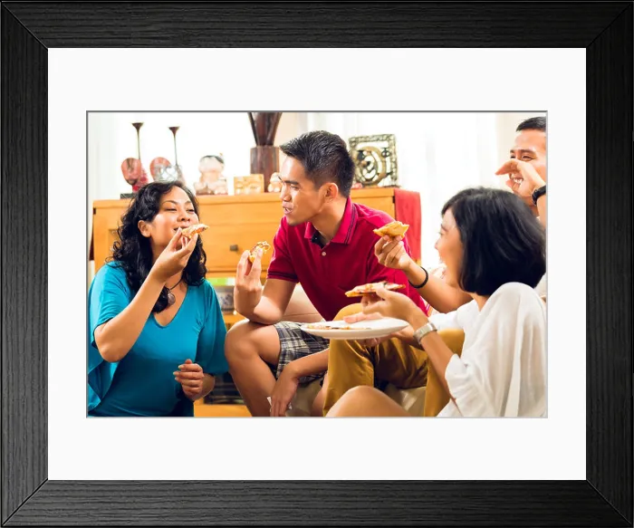 Framed Print : Asian people eating pizza at party or dinner and smiling Framed Print : Asian people eating pizza at party or dinner and smiling