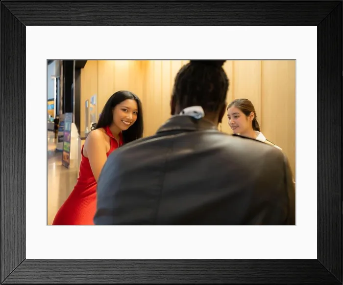 Framed Print : Asian ticket seller at the box office with the service of selling movie tickets to movie audiences in each round Framed Print : Asian ticket seller at the box office with the service of selling movie tickets to movie audiences in each round