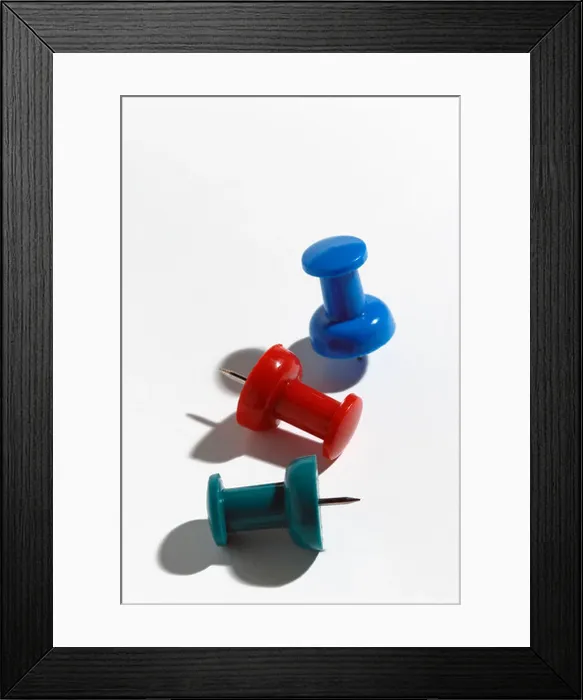 Framed Print : Red green and blue push pins on white paper Framed Print : Red green and blue push pins on white paper